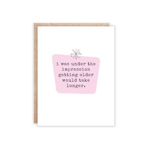 White card with pink center. I was under the impression getting older would take longer card. Portrait size.