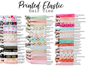May include: A collection of printed elastic hair ties in various colors and patterns. Designs include floral, geometric, and themed prints like "Bride Tribe" and "Aloha." The text "Printed Elastic Hair Ties" is at the top.