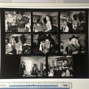 May include: A black and white photo collage of eight different images. Each image features a person in a different pose and setting. The images are arranged in a grid pattern.