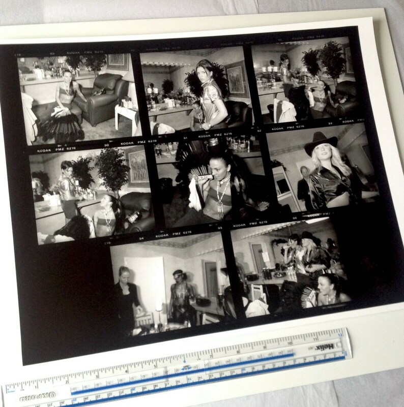 May include: A black and white contact sheet of photographs showing a woman in various poses. The woman is wearing different outfits, including a dress, a jacket, and a shirt. The photos were taken in a studio setting.