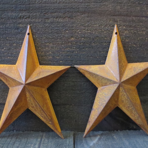 Lot of 2 Rusty Whimsical Tin Barn Stars 8 inches Tall Primitive Country Rusted Metal Rustic Stars