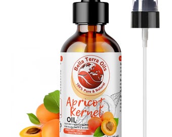 May include: A 2-ounce amber glass bottle of apricot kernel oil with a black dropper cap. The bottle has a white label with the text "Bella Terra Oils", "100% Pure & Natural", "Apricot Kernel Oil", "Nature's Moisturizer for Hair, Face & Body", "Unrefined - Organic - Cold-Pressed", and "2 fl oz (60 ml)". The bottle is surrounded by fresh apricots.