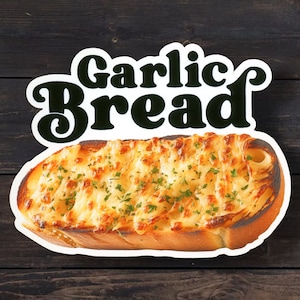 May include: A close-up of a garlic bread loaf with melted cheese and parsley on top. The bread is toasted and has a golden brown crust. The text "Garlic Bread" is written in black letters on a white background.