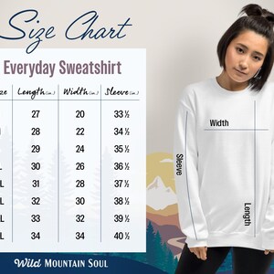 May include: Size chart for an everyday sweatshirt, showing measurements in inches for length, width, and sleeve length for sizes S through 5XL. The chart is overlaid on a graphic of a mountain range.