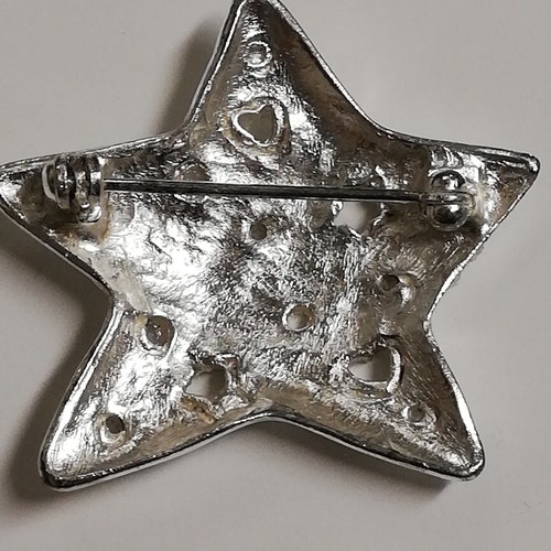 Star brooch Sonia Rykiel. Vintage shops Haute Couture. Chic and glamorous. Paris.
