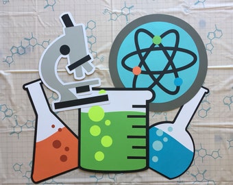 May include: A set of science-themed paper cutouts, including a microscope, a beaker, two flasks, and an atom. The beaker is filled with green liquid and has yellow bubbles. The flasks are filled with orange and blue liquids, respectively, and also have bubbles. The atom is surrounded by a gray circle and has a blue background.