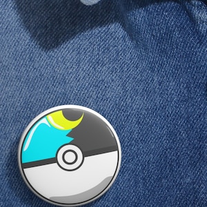 May include: A white and gray Poke Ball with a blue and yellow crescent moon design.