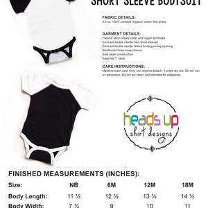 May include: Black and white raglan short sleeve bodysuit with a flatlock stitch ribbed collar and raglan armholes. The bodysuit has contrast double needle hem short sleeves and contrast double needle ribbed binding on the leg opening. The bodysuit has a reinforced three snap closure, side seam construction, and an EasyTear label. The bodysuit is available in sizes NB, 6M, 12M, and 18M. The measurements are listed in inches.