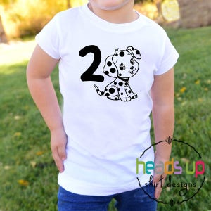 May include: White t-shirt with a black number 2 and a black and white dalmatian puppy graphic. The text "heads up shirt designs" is visible in the lower right corner of the image.