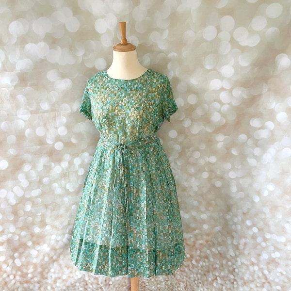 Volup vintage, UK Size 18, US 14. Late 50s or early 60s day dress. Green, semi sheer house or occasion dress with geometric square print