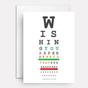 May include: A white card with a black eye chart that says "W I S H I N G Y O U" in black letters. The letters are in different colors, including green, blue, pink, and orange.