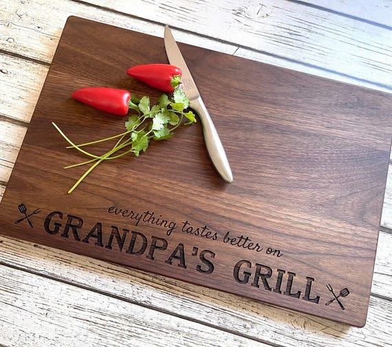 3,026 favorites don't lie — this BBQ/grilling-themed personalized hardwood board has clearly become a go-to Father's Day gift with real staying power.