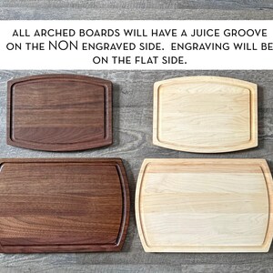 four different types of wooden cutting boards, each with a unique shape and size, arranged on a wooden surface.