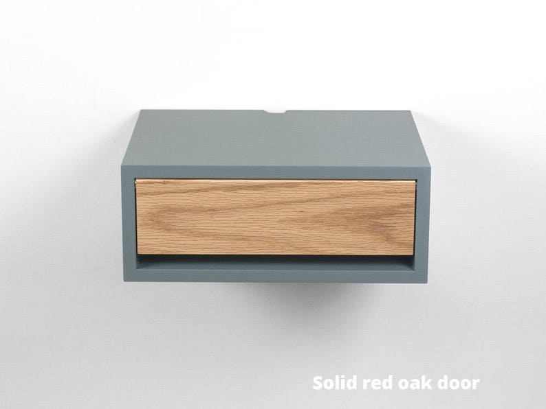 May include: A gray floating nightstand with a single drawer made of solid red oak wood.