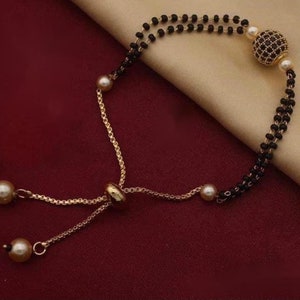 LOVELY Black Stone Mangalsutra Bracelet Gold Plated with Chain Gold AD Diamond Ball