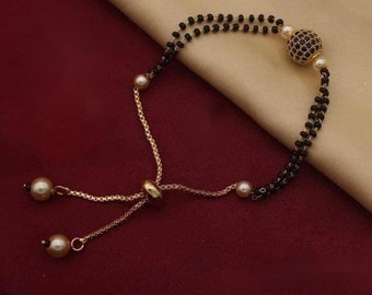 LOVELY Black Stone Mangalsutra Bracelet Gold Plated with Chain Gold AD Diamond Ball