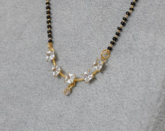 Mangalsutra plaqué or diamant AD/ Mangalsutra en perles noires.