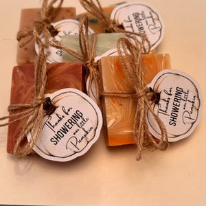 May include: Small bars of soap wrapped in twine and tied with a tag that says "Thanks for showering our little pumpkin".