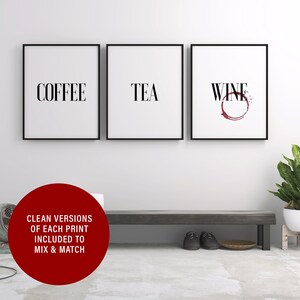 May include: Three black framed prints with white backgrounds and black text. The prints read "Coffee", "Tea", and "Wine" with a red wine stain under the word "Wine".