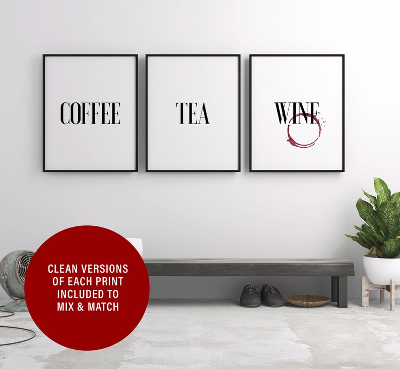 May include: Three black framed prints with white backgrounds and black text. The prints read "Coffee", "Tea", and "Wine" with a red wine stain under the word "Wine".