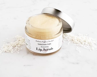 May include: A small glass jar of coconut lip scrub with a silver lid. The jar is labeled "Andreas Organic Market Luscious Lips Coconut Lip Scrub 1.5 oz."