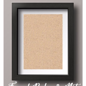 May include: A black framed picture with a burlap mat inside. The burlap is a light beige color.