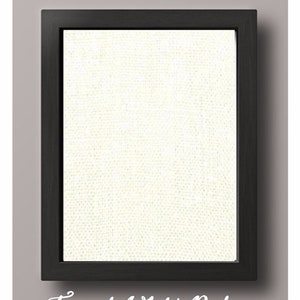 May include: A framed white burlap canvas with a black frame. The canvas is textured and has a subtle sheen.