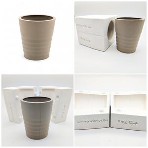 May include: A beige ceramic ring cup with a ridged exterior. The image also shows the white mold used to create the cup. The mold is labeled "Ring Cup" and "HOTCAKESUSA.com".