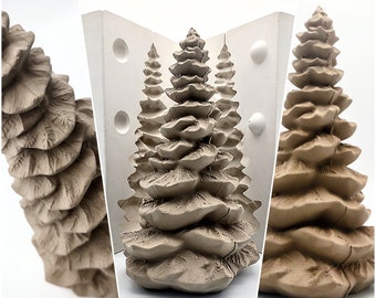 May include: A silicone mold for making three small, detailed, brown, ceramic Christmas trees. The mold is white and has a smooth surface.