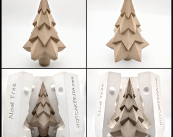 May include: A two-piece silicone mold for making a geometric Christmas tree cake. The mold is white and has the words "Noel Tree" and "HOTCAKESUSA.com" printed on it. The mold is open and shows a brown geometric Christmas tree cake inside.