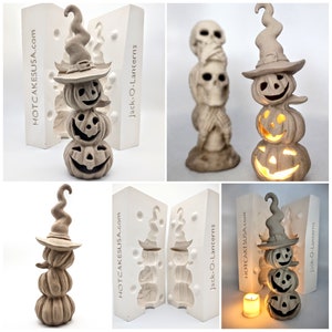 May include: Two silicone molds for making stacked jack-o'-lantern candle holders. The molds are white and have the text "HOTCAKESUSA.com" and "Jack-O-Lanterns" printed on them.