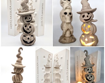 May include: Two silicone molds for making stacked jack-o'-lantern candle holders. The molds are white and have the text "HOTCAKESUSA.com" and "Jack-O-Lanterns" printed on them.