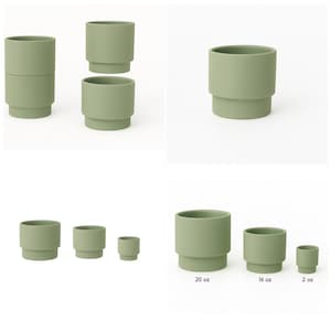 May include: Sage green ceramic cups in various sizes. The cups have a stepped base and a cylindrical body. Sizes include 2 oz, 16 oz, and 20 oz. The cups are stacked in some arrangements. The overall aesthetic is minimalist and modern.