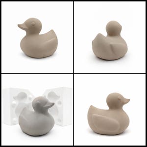 May include: A collection of four images showcasing a gray duck figurine. The duck has a smooth, rounded body with a small beak and a simple, minimalist design. One image shows the duck next to a white mold.
