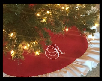 Handmade Christmas Tree Skirt in Red with white ruffled trim.