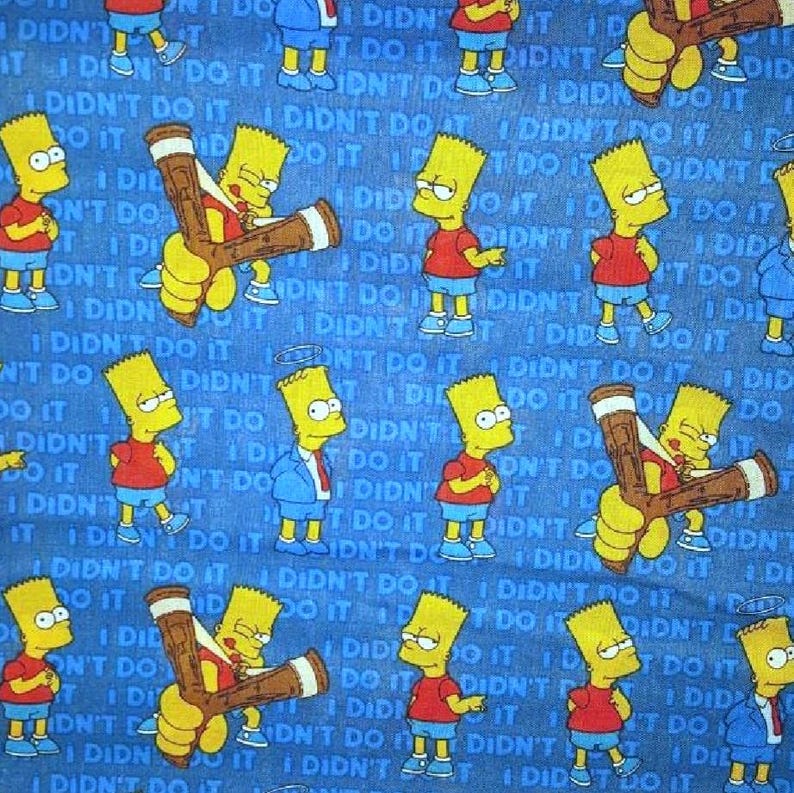May include: A blue fabric with a repeating pattern of yellow cartoon characters holding a slingshot. The text 'I didn't do it' is repeated throughout the fabric.