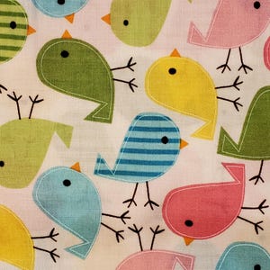 May include: A fabric pattern featuring colorful, cartoon-style birds in shades of green, blue, yellow, and pink. Each bird has a black eye, orange beak, and black legs. The birds are set against a white background.