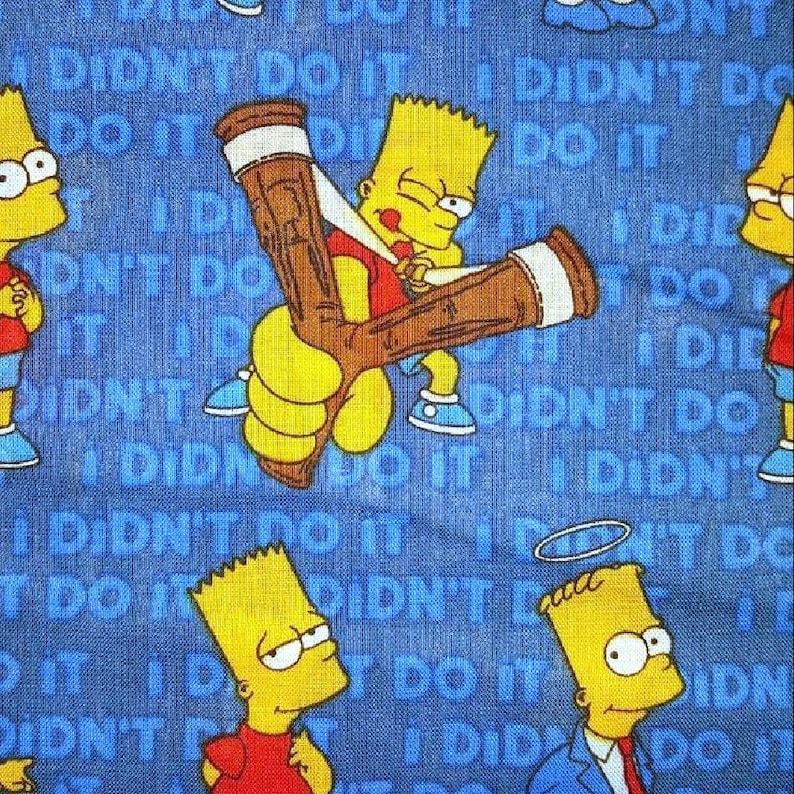 May include: A blue fabric with a repeating pattern of yellow cartoon characters and the text 'I didn't do it'.