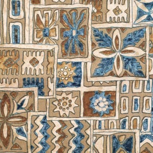 May include: A close-up of a patterned fabric with a repeating design. The pattern features squares and rectangles in shades of beige, brown, and blue. The design includes floral and geometric shapes, creating a textured appearance.