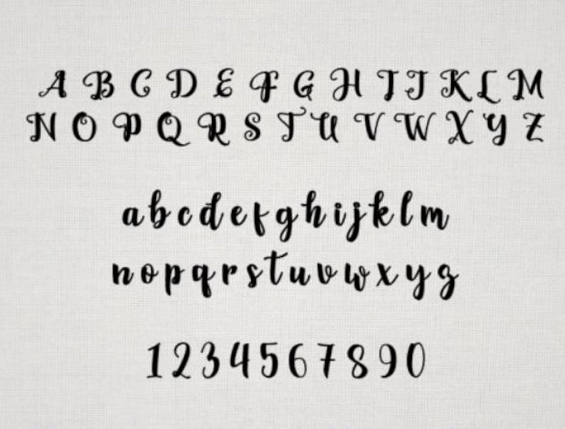 May include: A black script font alphabet display featuring uppercase letters A through Z, lowercase letters a through z, and numerals 0 through 9. The characters are presented in a flowing, cursive style against a light, textured background.