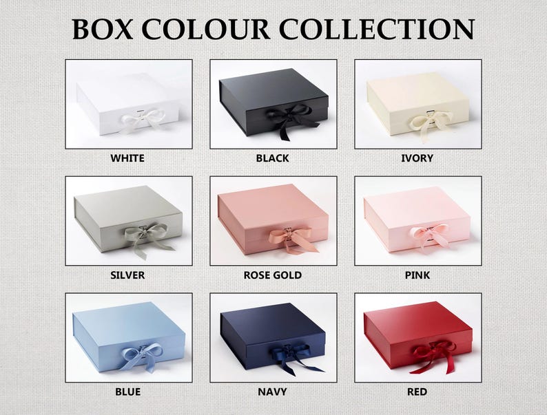May include: A collection of nine square gift boxes with ribbon closures, labeled BOX COLOUR COLLECTION. Colors include white, black, ivory, silver, rose gold, pink, blue, navy, and red. Each box features a matching ribbon tied in a bow at the front.