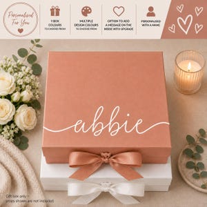 May include: A square, dusty rose gift box with a matching ribbon bow, featuring the name abbie in white script. Below it sits a white gift box with a white ribbon bow. The text includes Personalised For You, 9 box colours, and more.