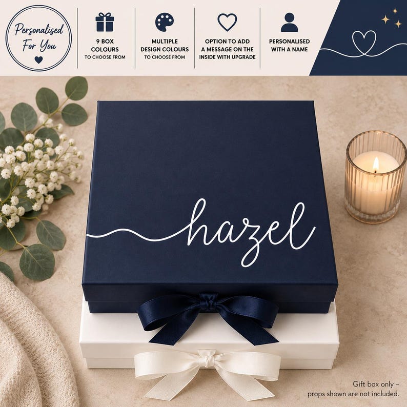 May include: A square navy blue gift box with a white ribbon and the name hazel printed in white script. Below it sits a white gift box with a white ribbon. The top banner text reads: Personalised For You, 9 box colours to choose from, multiple design colours to choose from, option to add a message on the inside with upgrade, personalised with a name.