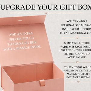 May include: A dusty pink rectangular gift box with a hinged lid. The interior lid features the white text: ADD AN EXTRA SPECIAL TOUCH TO YOUR GIFT BOX WITH A MESSAGE INSIDE. The top of the image displays the text: UPGRADE YOUR GIFT BOX.