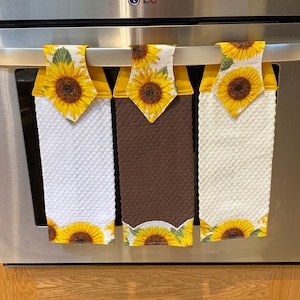 Embroidered Scalloped Sunflower Hanging Kitchen Towel, Everyone’s favorite. Brighten your kitchen.  Waffle Weave towel, choose from3 colors.