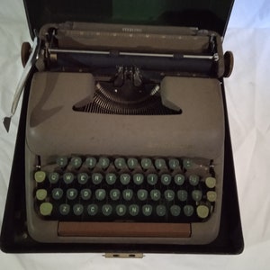 Corona Manual Portable Typewriter.with wooden carrying case.Works well.All colors and brands available.