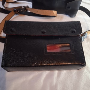 Vintage Shoulder Bag, thick black color with a small pocket on the belt,