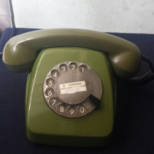1 Vintage green manual telephone. landline telephone, Old Phone, Retro Vintage telephone, rotary telephone.