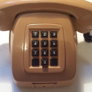 1 Vintage brown manual telephone. landline telephone, Old Phone, Retro Vintage telephone, push button telephone.