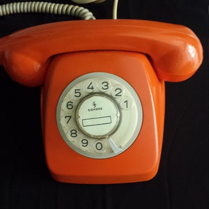 Vintage orange telephone, retro telephone, orange rotary telephone, orange telephone, landline telephone, Bakelite telephone, office telephone